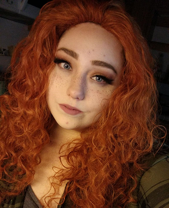 woman with orange curly hair and freckles