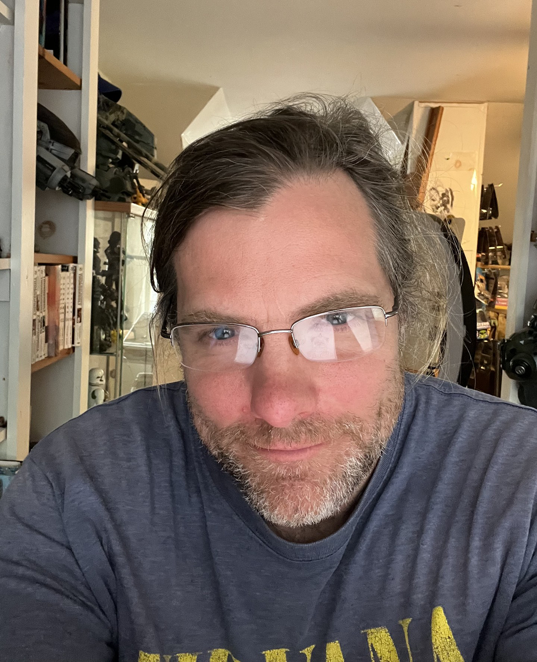Man with beard, brown hair, and glasses