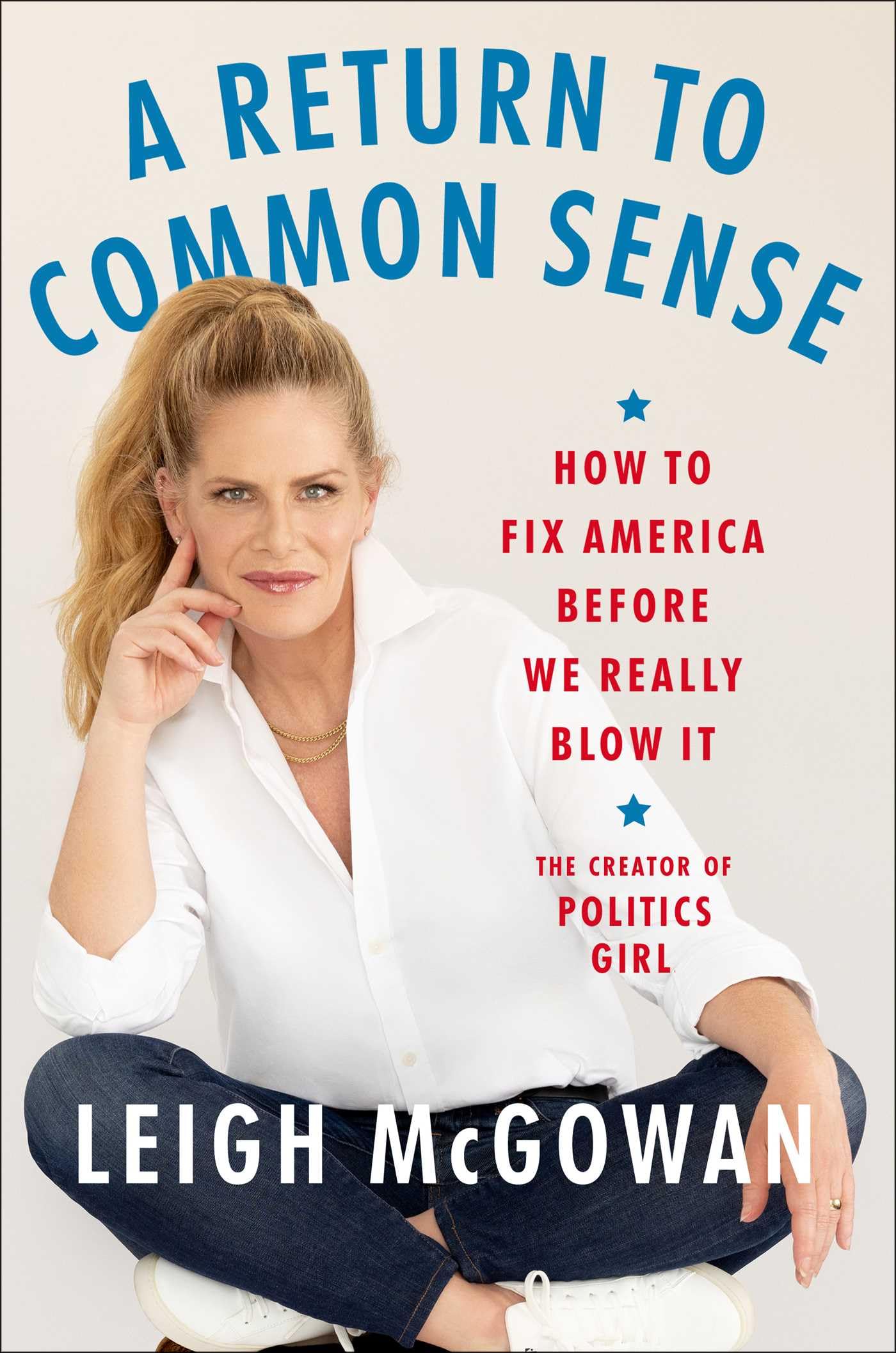 The author sits cross-legged against a white background