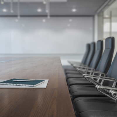 A row of office chairs at a long table