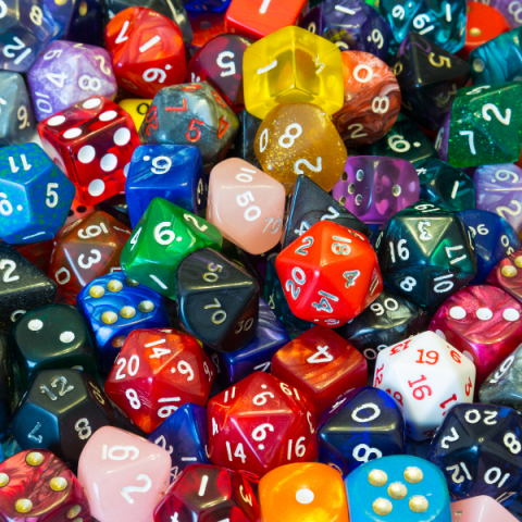 Array of different sided dice in multiple colors