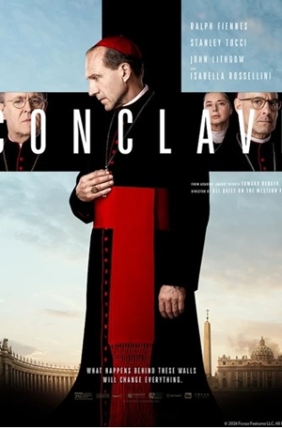 A Catholic Cardenal, (Ralph Fiennes), stands in front of a black cross set againstthe Vatican skyline