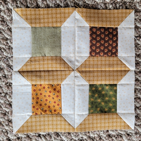 Quilt block sewn from fabrics with differing patterns