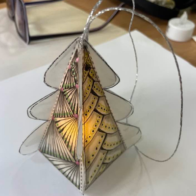 vellum triangle shaped luminary with tea light inside