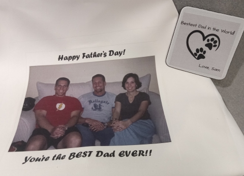 White shirt with photograph of three people with caption, "Happy Father's Day!! You're the BEST Dad Ever! White coaster with black dog paw prints and caption, "Bestes Dad in the World! Love, Sam. heart