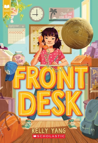 Asian Girl working at desk on the phone.