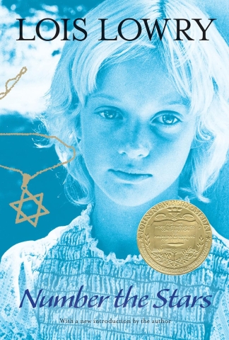 Face of young blond girl next to a Star of David necklace