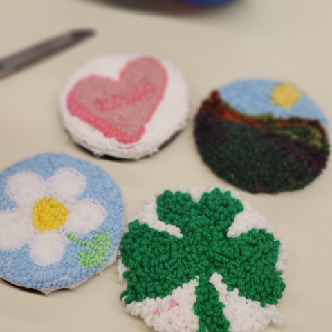 a flower, heart, landscape, and shamrock mug rug