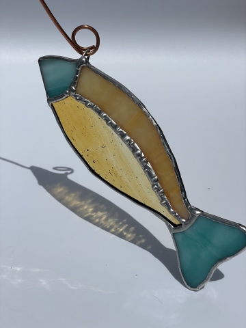 stained glass fish with teal head/tail and yellow body