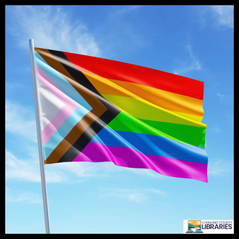 pride flag against blue sky 