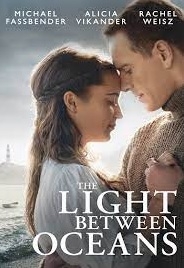 Man & Woman embrace at ocean edge with lighthouse and rowboat in the background. Title text is superimposed in white covering the bottom quarter of the image.