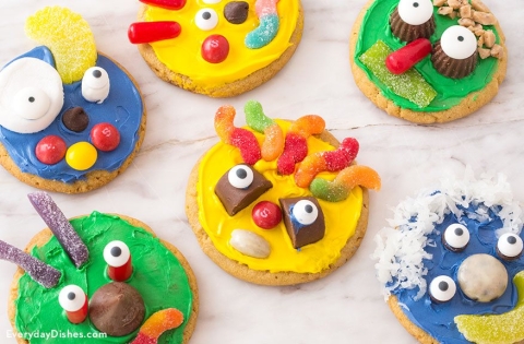 Monster Cookies decorated with colorful frosting and edible google eyes and gummy worms