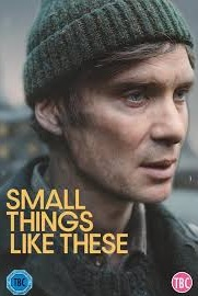 Close-up of the protagonist, actor Cillian Murphy in a green cap with th films title in yellow text superimposed on the bottom half of the image flush left
