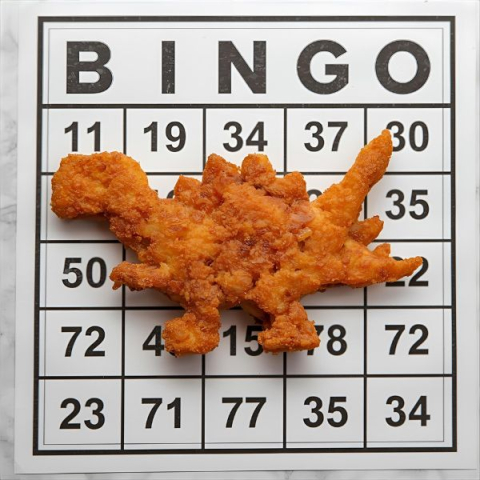 dinosaur shaped chicken nugget on a bingo card