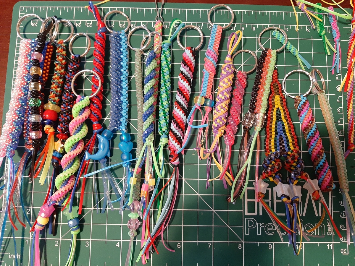 An array of multi-colored boondoggle keychains