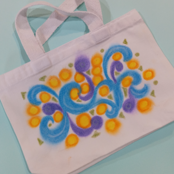 Canvas tote bag with colorful swirls