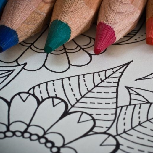 Image of colored pencils and a blank coloring page