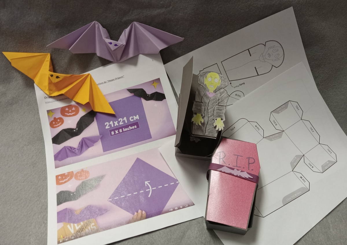 Purple and orange paper bats with paper vampire coffin with instructions for both.
