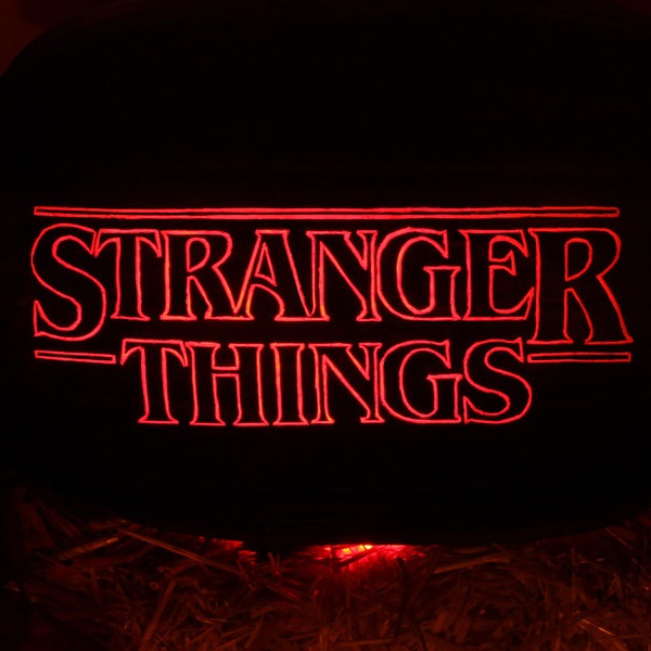Stranger Things logo in red text on black background