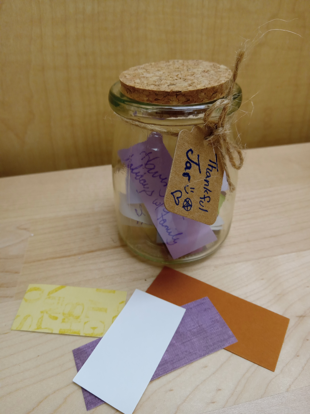 Glass jar with colored paper